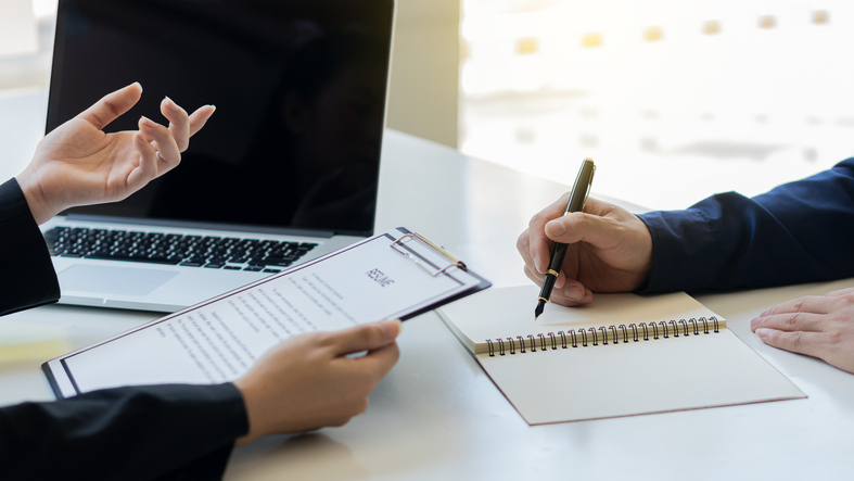 Employers check the resume of job applicants and interview them at work.